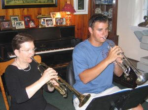 Ms. Craw with trumpet student